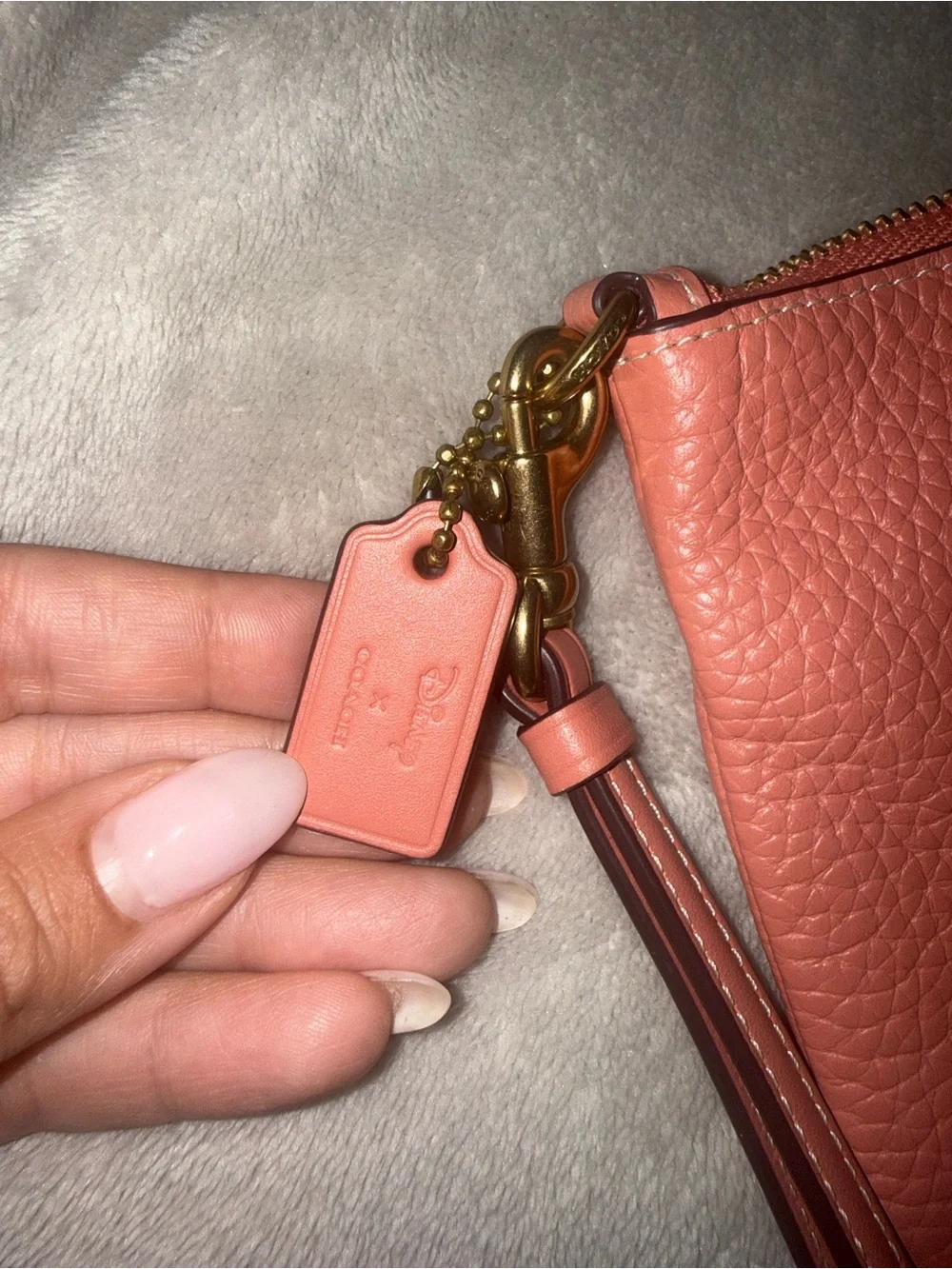 COACH x DISNEY Daisy Leather Wristlet Pouch in Coral Pink
